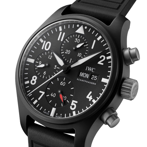 Close-up view of the IWC Pilot’s Watch Chronograph TOP GUN IW389401, showcasing a sleek black ceramic case and a bold black dial with luminous markers and chronograph sub-dials. The watch features uncoated steel pushers and the iconic TOP GUN decoration on the caseback, emphasizing its tactical design. With a 41.9mm diameter and 100M water resistance, this timepiece perfectly blends functionality and style.